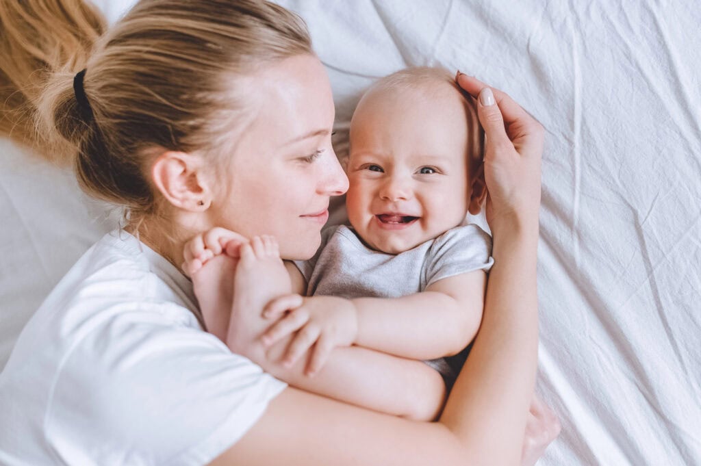 mom holding her happy baby